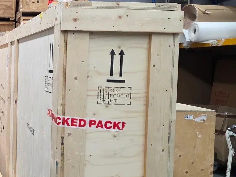 Close view of a wooden fine-art crate in a storage warehouse